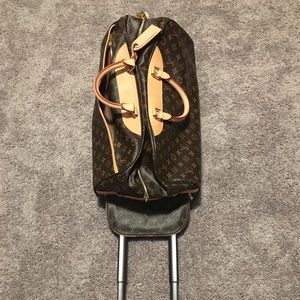 Vintage Louis Vuitton luggage;dustbag, lock & key.